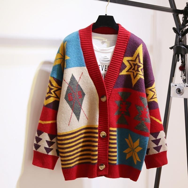 Woman layering a thick winter cardigan over a sweater and scarf