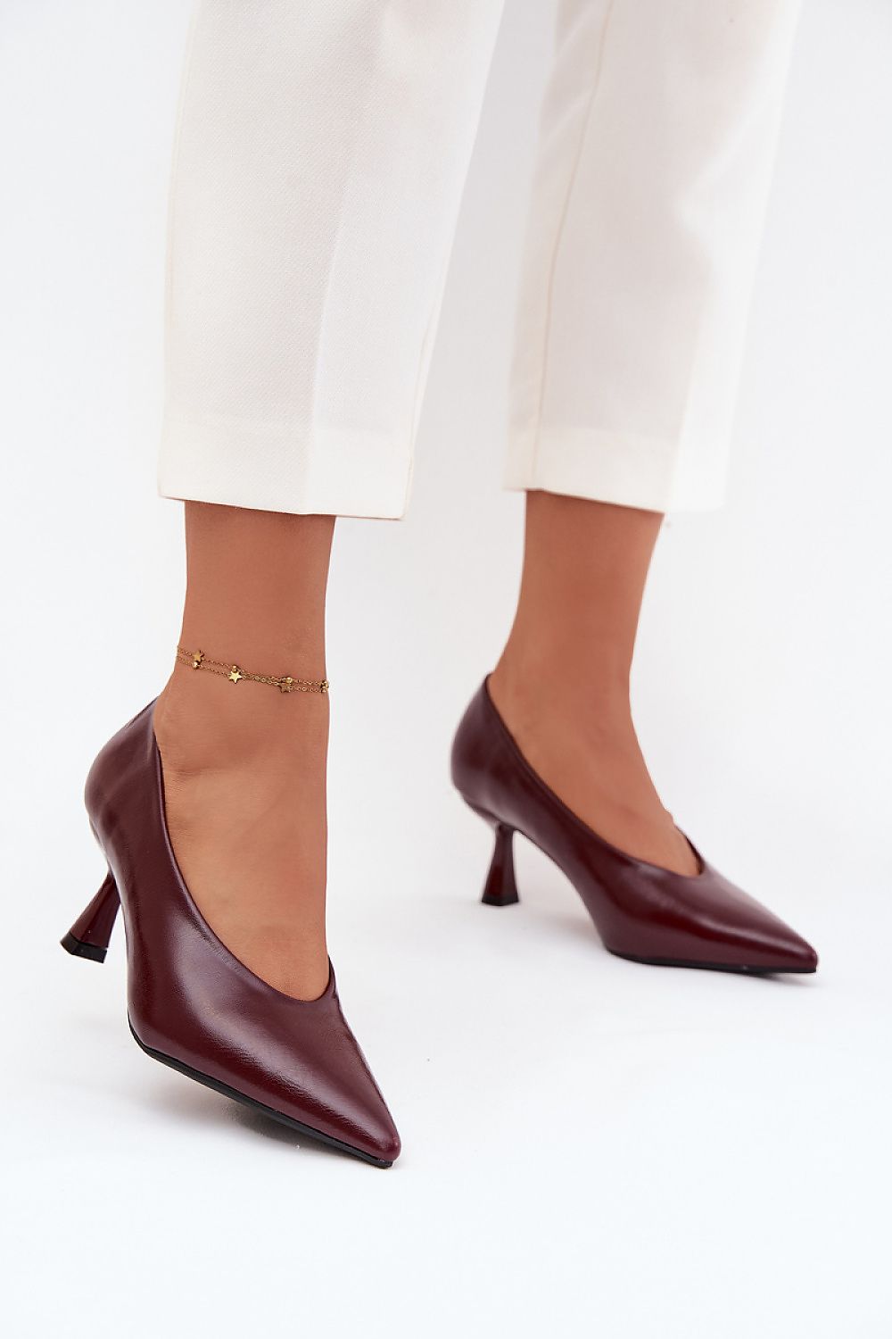 Women's red slip-on pointed toe stiletto pumps - front view